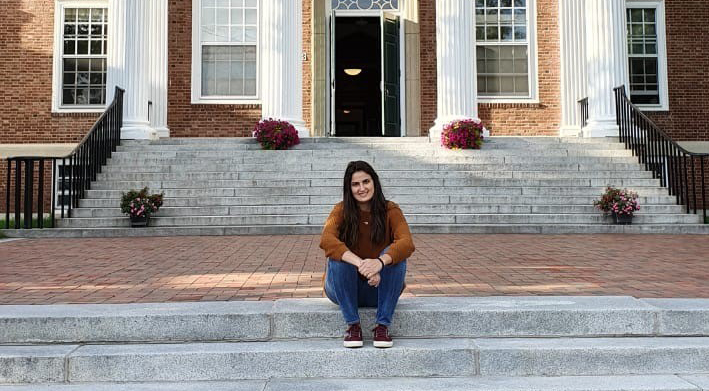 Female sitting on cement steps