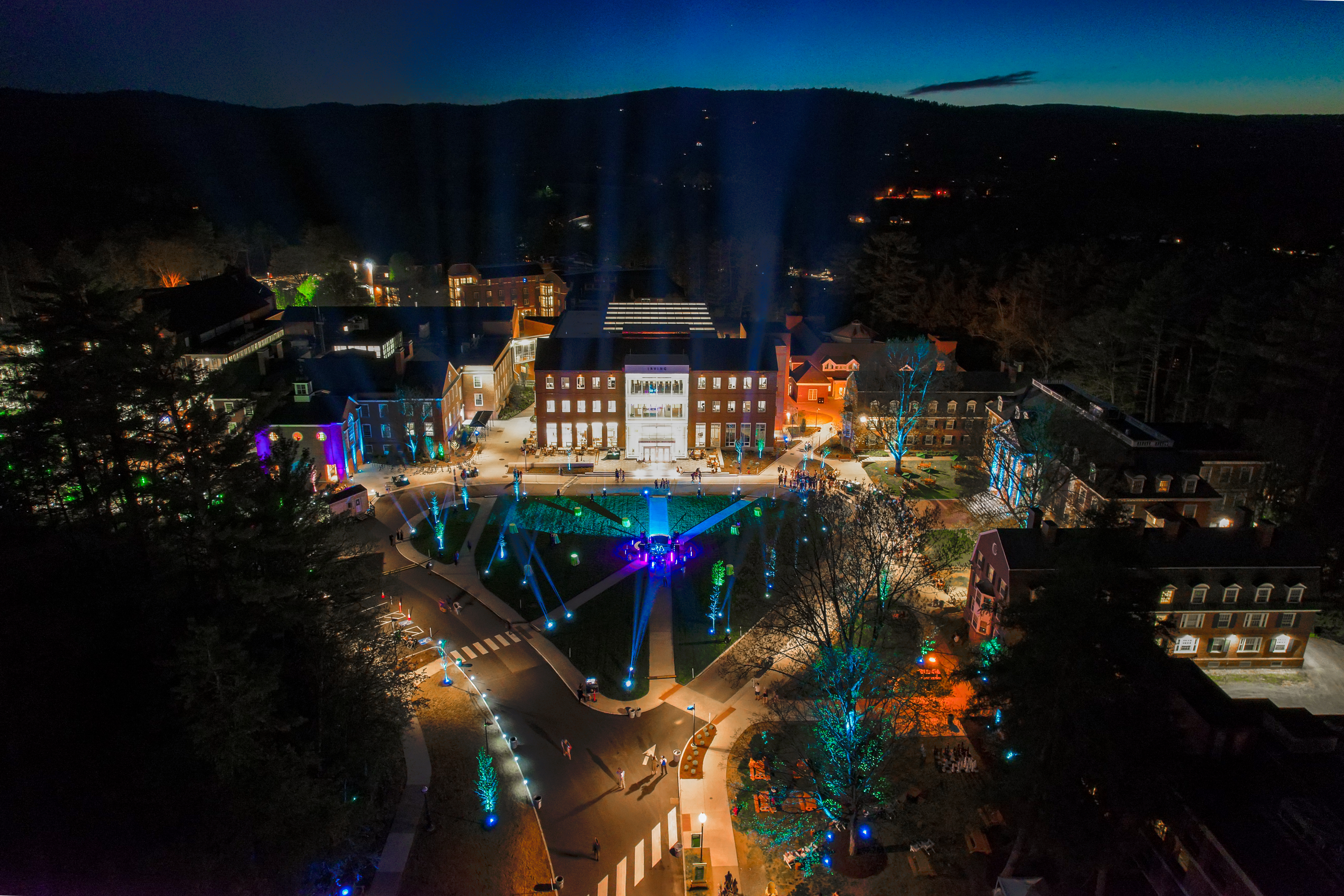 a birdseye view of the West End and Tuck mall lit up at night