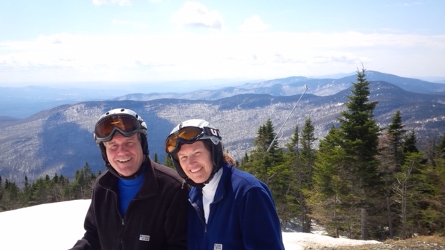 Man and woman in ski gear on a mountain