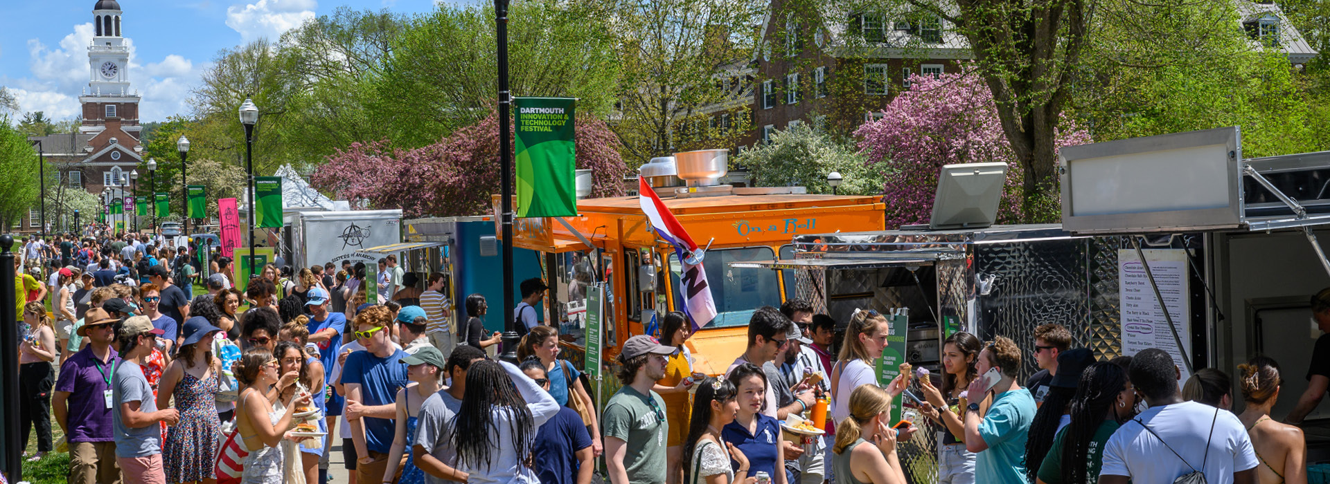 Tuck drive packed with students and community members lined up outside food trucks