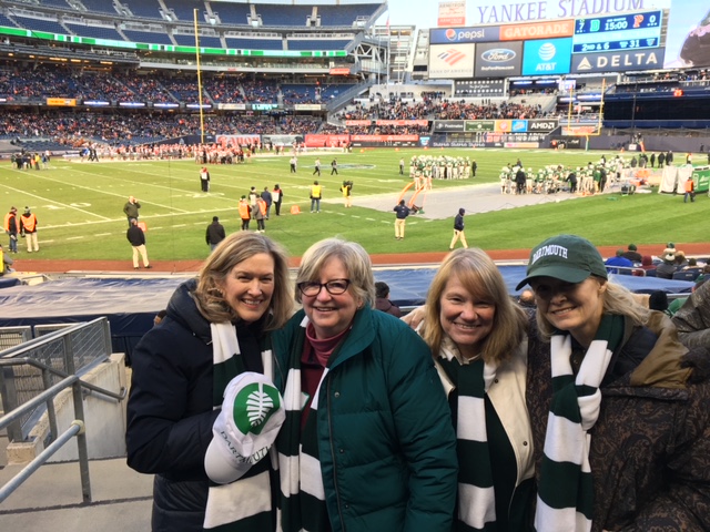 four women at a game at Yankee stadium
