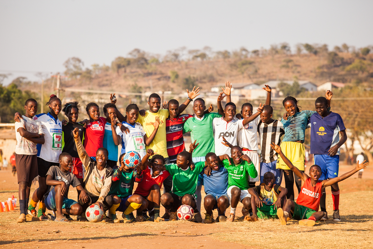 Grassroot Soccer participants celebrate in Zambia, near Lusaka. (Courtesy of Grassroot Soccer)