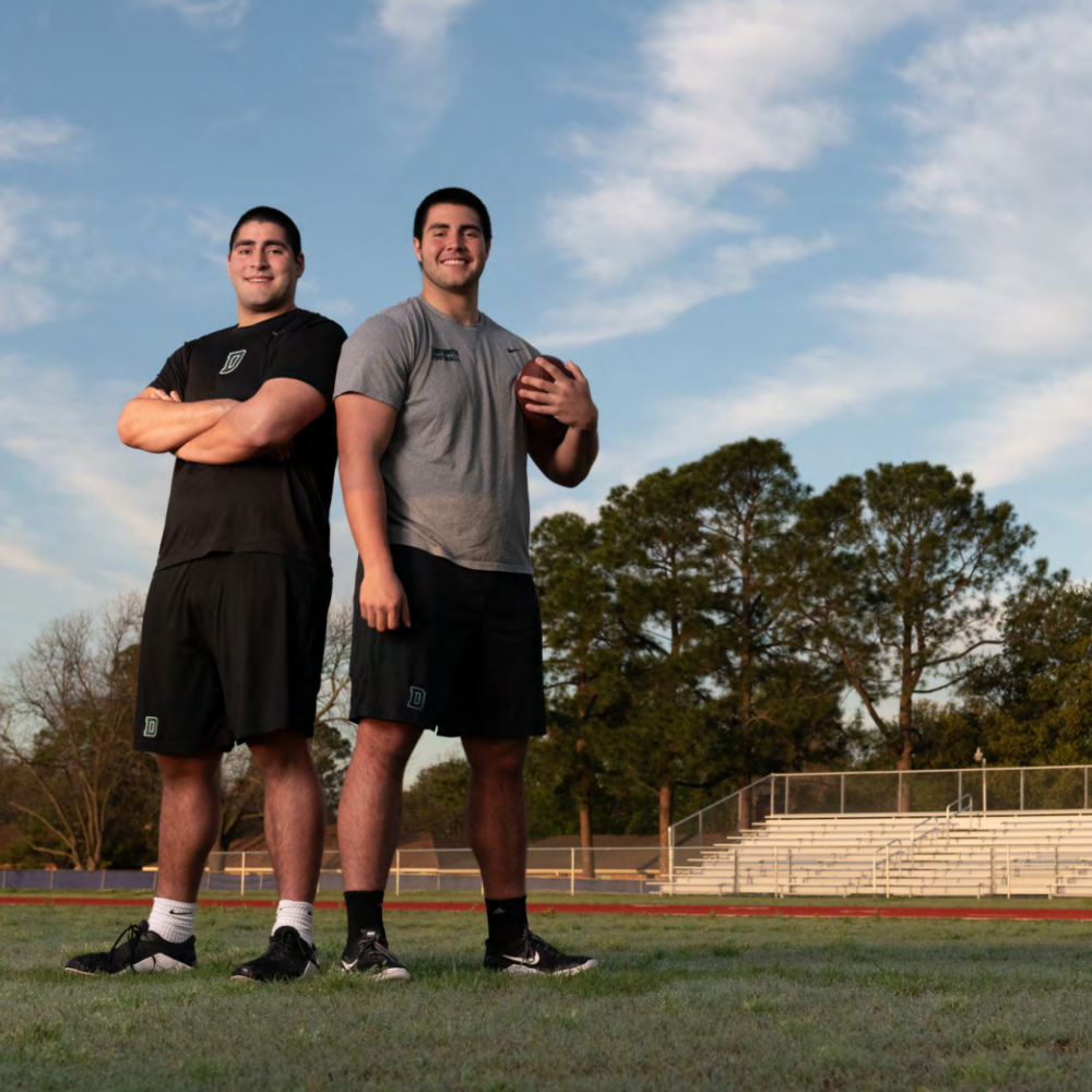John Flores ’22 and Michael Flores ’23 on a football field