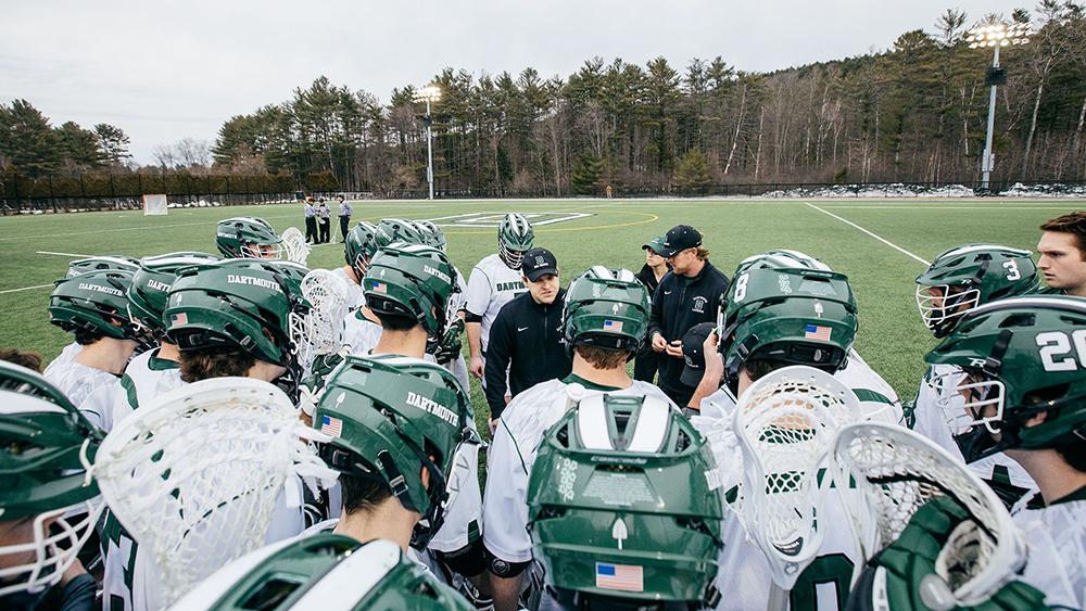 An overhead shot of head coach Brendan Callahan addressing a huddle