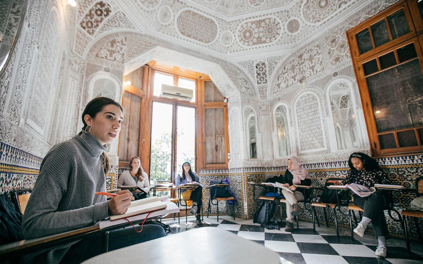 Woman and students in a study room