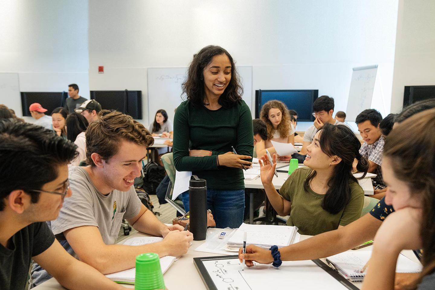 Students working around a table in a classroom