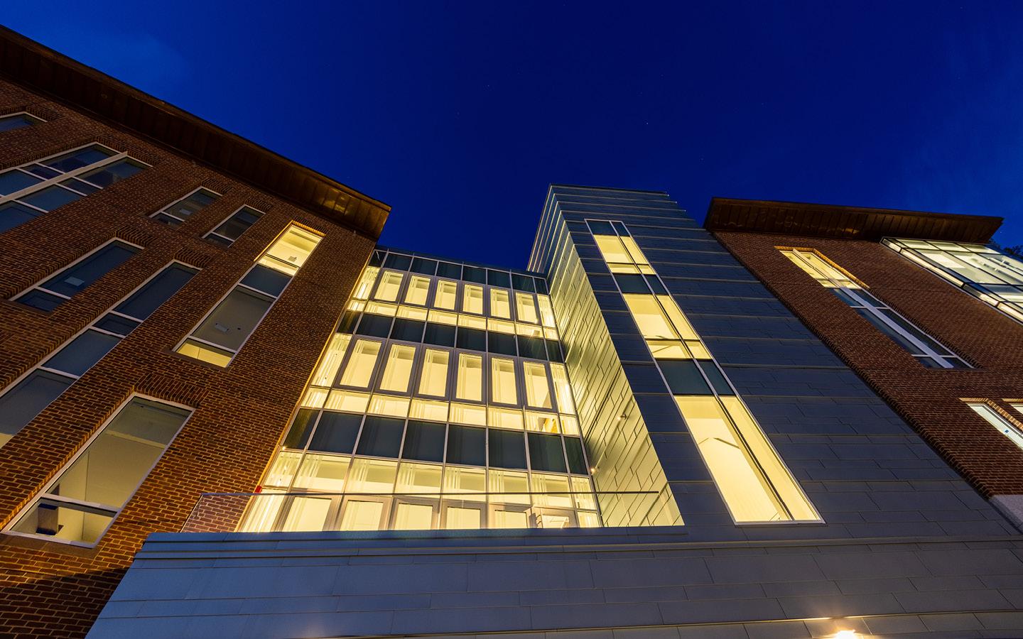 an exterior image of the Class of 82 Engineering Computer Science Center at night