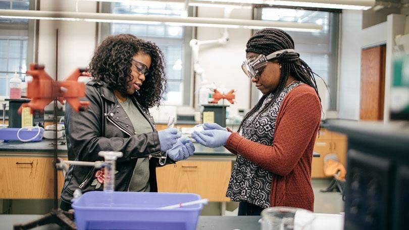 Two Dartmouth students in the lab