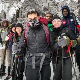 Students in winter gear pose for a picture