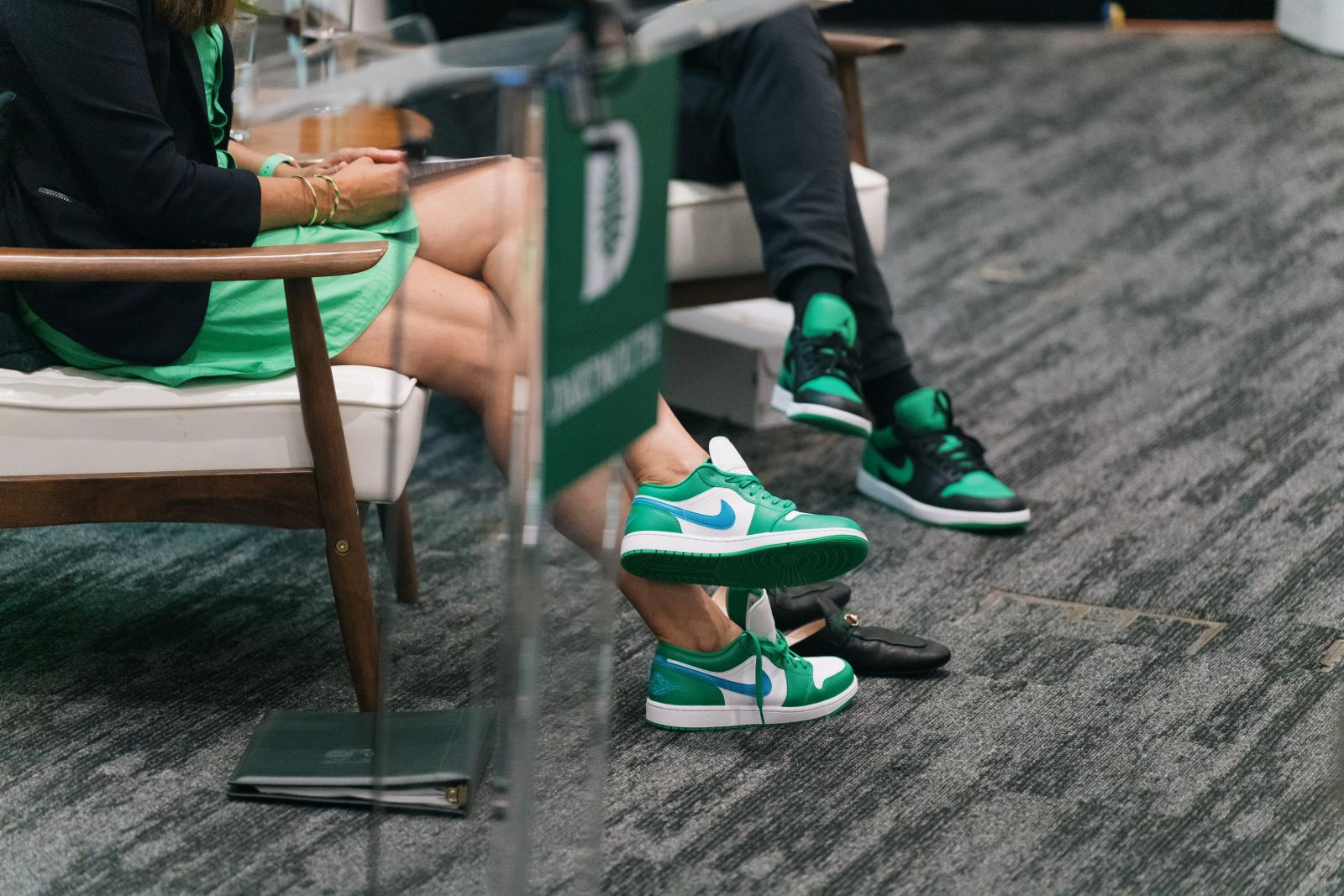 Green and white Nike Jordans on President Beilock's feet