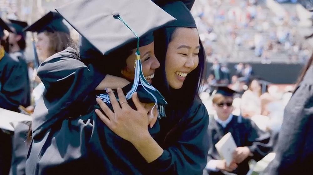 Two Dartmouth graduates hugging during Commencement