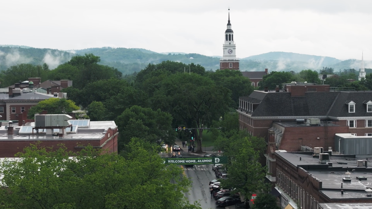 Aerial shot of Main St. - Welcome Home Alumni banner & Baker Tower