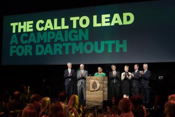 The deans, president, and chair of the board of trustees on stage at a campaign event.