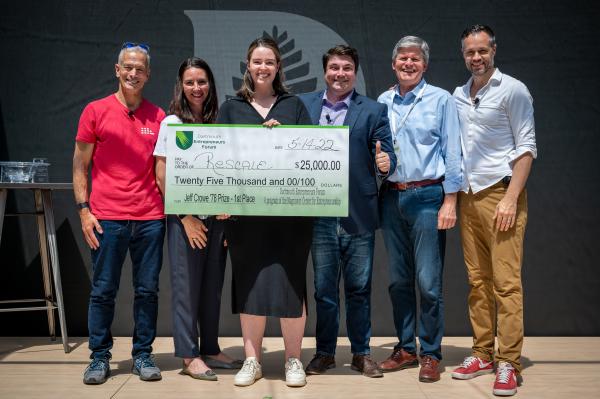 Geoff Ralston ’82, Caroline Hribar ’00, competition winner Julia Megson TU’23, Jamie Coughlin, Jeff Crowe ’78, and Errik Anderson ’00 TH’06 TU’07 pose during a check presentation