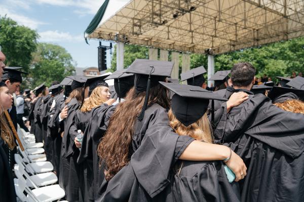 Graduates wearing caps and gowns at Commencement