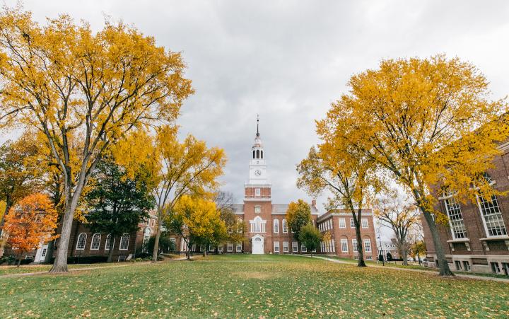 Baker Library flanked by trees with fall color