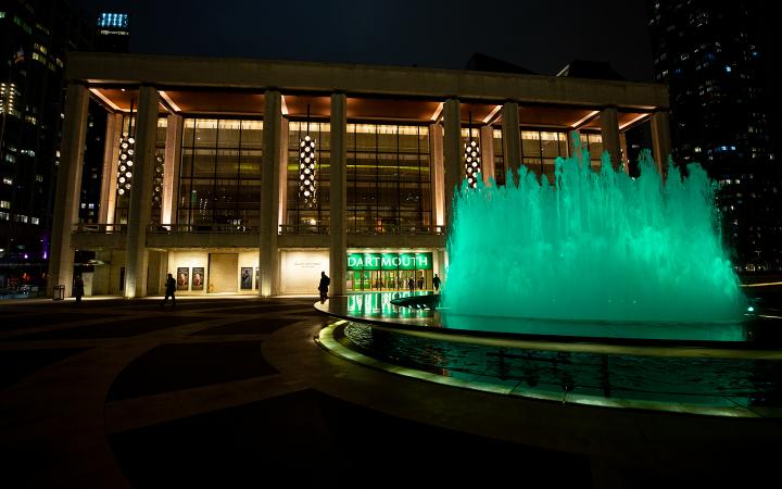 The fountain outside Lincoln Center, lit green for Dartmouth.