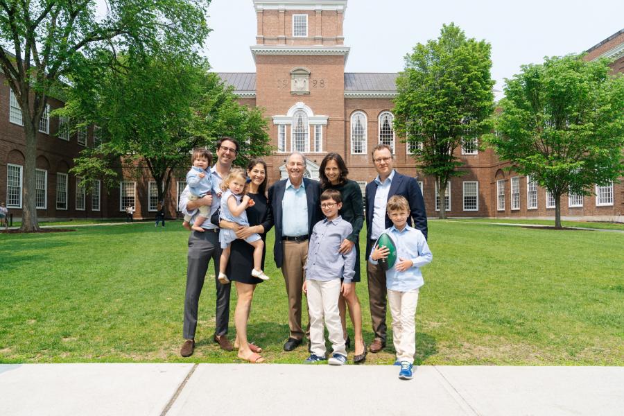 The Reiss family posing in front of Baker Library