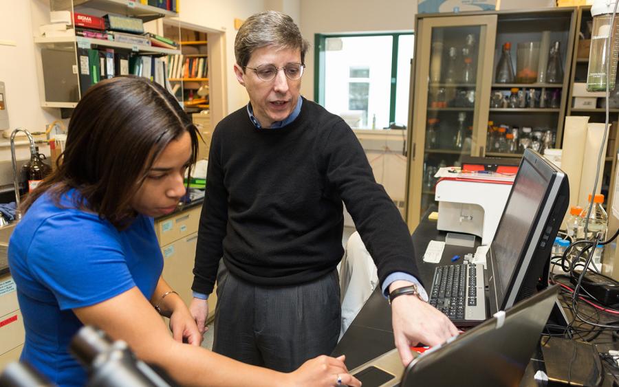 Immunology Program member and Professor of Microbiology and Immunology Charles Sentman in a teaching moment with Tiffany Coupet, Guarini ’20, in a photo taken pre-COVID-19 protocols.